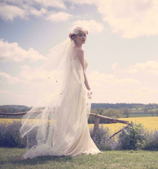 Professional photo of a bride standing in fields